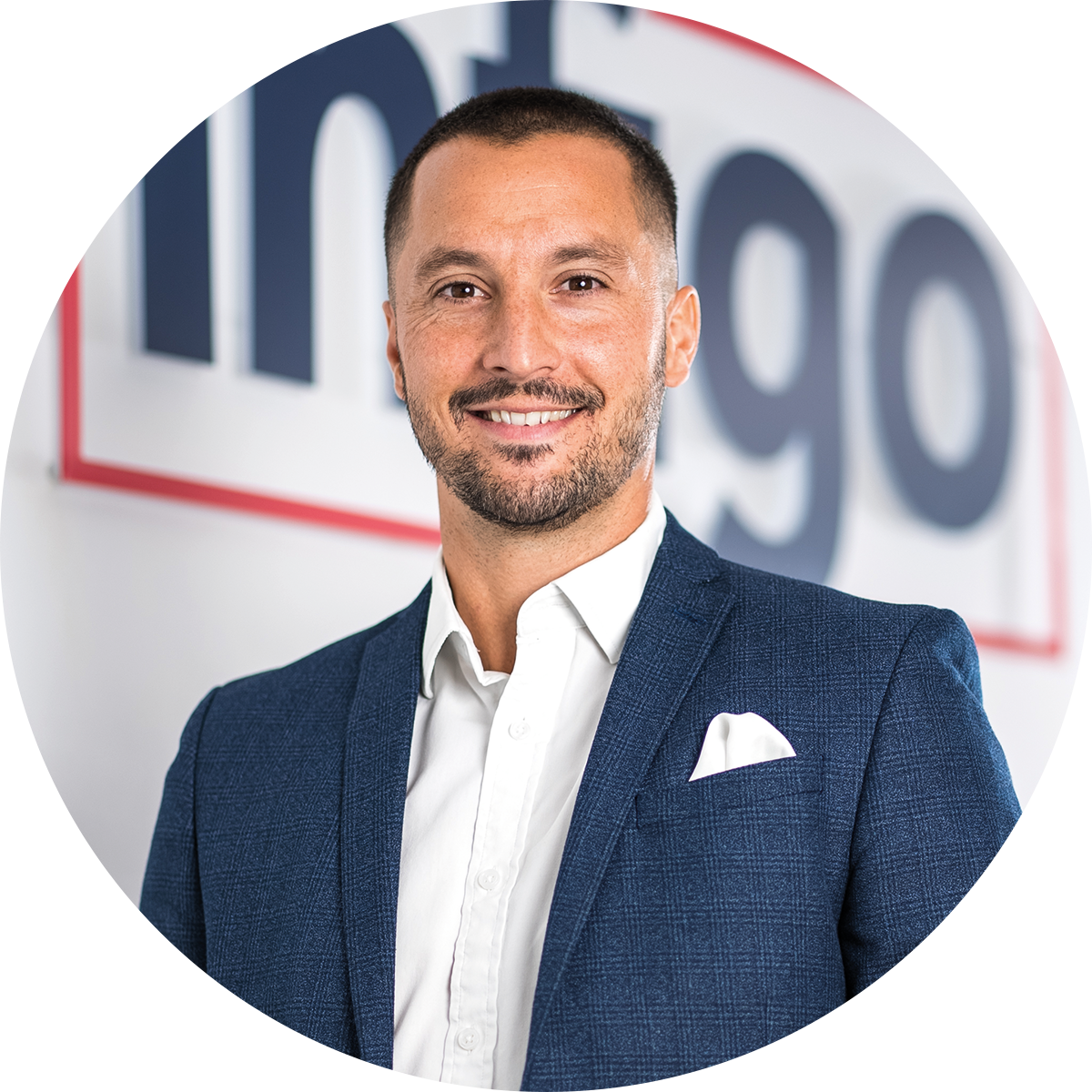 Alex Bowell in front of Infigo logo