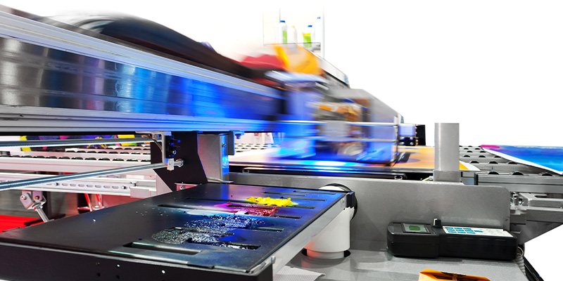 Working industrial large format UV inkjet printer for printing on big sheets of plastic or billboards isolated over white