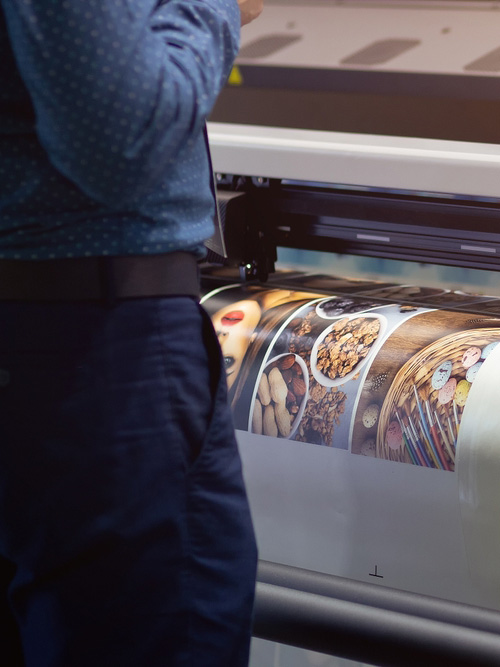 Man Observing Industrial Printer