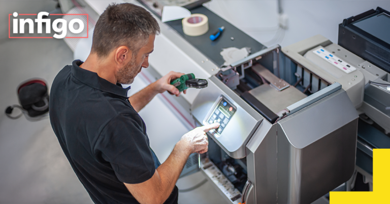 Man operating industrial printer
