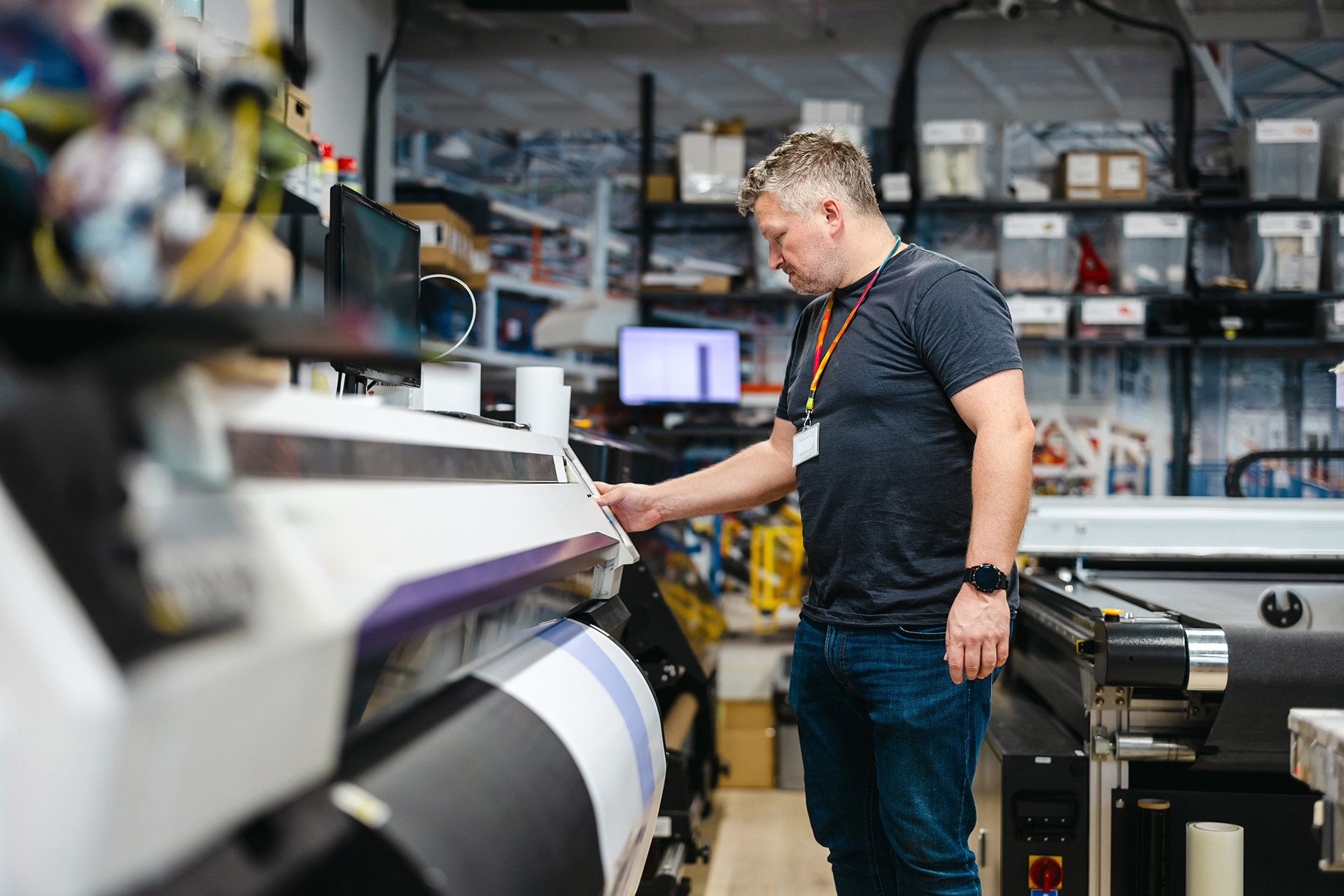 Print operator changing settings on print machinery